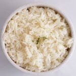 Bowl of freshly cooked, fluffy parboiled rice.