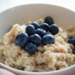 Quick and tasty microwave-cooked steel-cut oats, topped with blueberries.