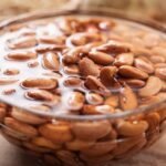 Bowl of beans soaking overnight in water – the smart way to soak beans overnight for better cooking and digestion