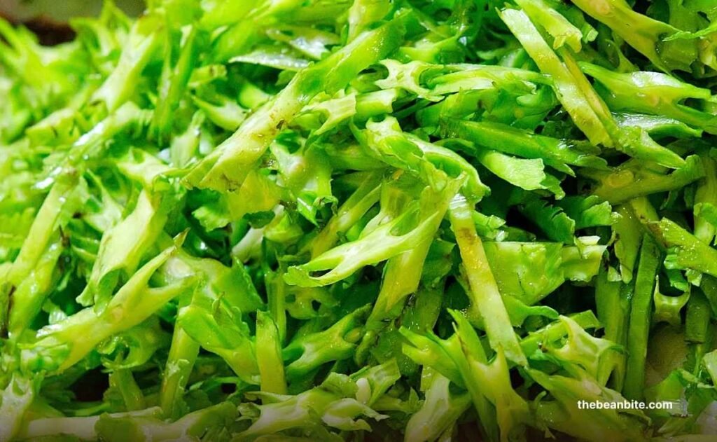Close-up of star-shaped winged bean slices, naturally formed from cutting, highlighting their ridged texture and fresh green color Close-up of star-shaped winged bean slices, naturally formed from cutting, highlighting their ridged texture and fresh green color